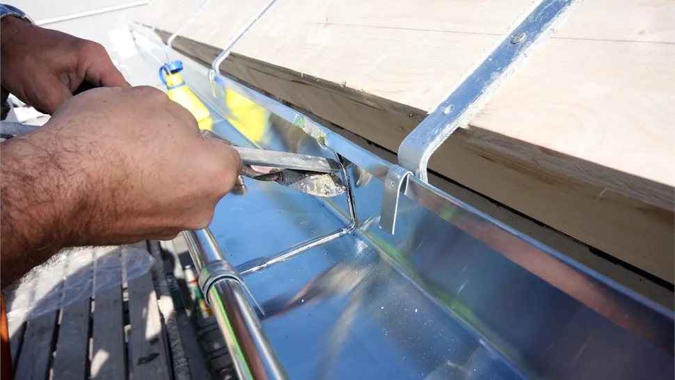 Sealant applied along the inside seam of a gutter
