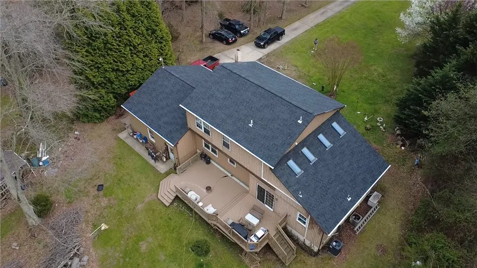 Aerial view of six skylights set into a newly shingled roof slope